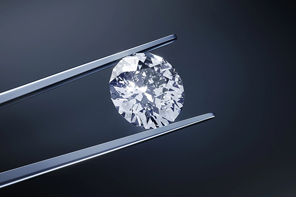 Diamond held by tweezers.