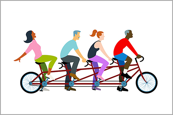 People riding a tandem bike.