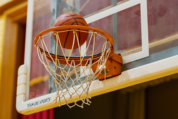 Basketball going into a net.