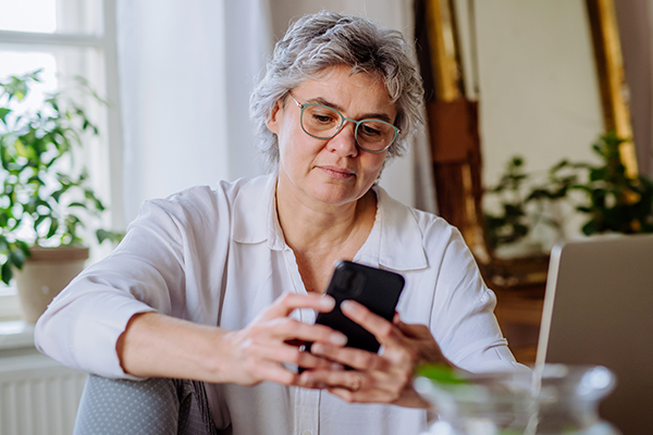 Person using their smartphone.