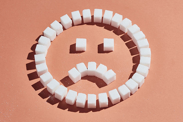 Sugar cubes arranged as a frown.
