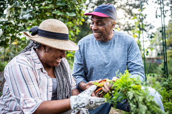 Happy people enjoying yardwork.