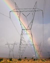 Rainbow over electrical towers