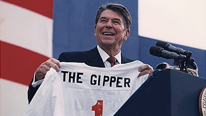 President Ronald Reagan accepts a shirt commemorating his most famous film role
