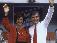 Democratic Presidential nominee Michael and Kitty Dukkakis waving from back of train on campaign trail in 1988.