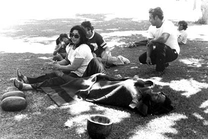 Helen Chávez gives her husband César Chávez a foot rub during a break in the 1,000 Mile March through California during the summer of 1975. The march was a 59 day trek organized by the UFW, from the Mexican border at San Ysidro to Salinas and then from Sacramento south down the Central Valley to the UFW's La Paz headquarters at Keene, southeast of Bakersfield. 