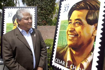 Paul Chávez, the son of civil rights and farm labor leader César E. Chávez, looks at a replica of the stamp the U.S. Postal Service unveiled in Los Angeles on Wednesday, April 23, 2003, the 10th anniversary of Chávez's passing. "It is a proud moment for the Postal Service to pay tribute to this great man who stands as a true American hero," said Benjamin Ocasio, vice president of diversity, U.S. Postal Service.