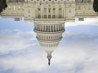 Capitol building upside down – Medicare and Medicaid spending along with Social Security checks are threatened in stalled debt talks.