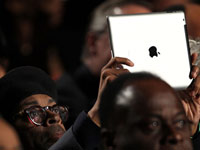 Director Spike Lee holds an iPad.