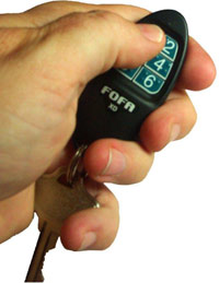 Hand using key FOB for Find One Find All device