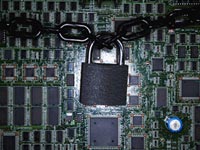 Lock chained around computer chips, online credit card application safety
