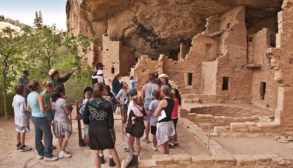 tour guide showing visitors artifacts at Mesa Verde National Park