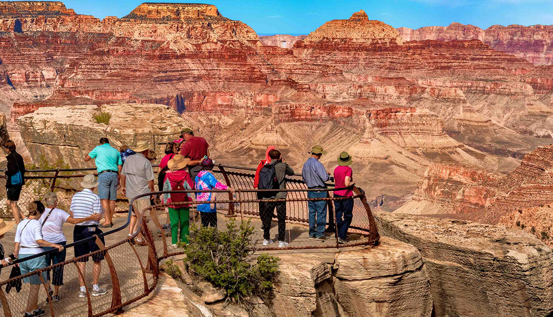 Tourists take in the incomparable vista of the Grand Canyon in Arizona from a south rim viewpoint