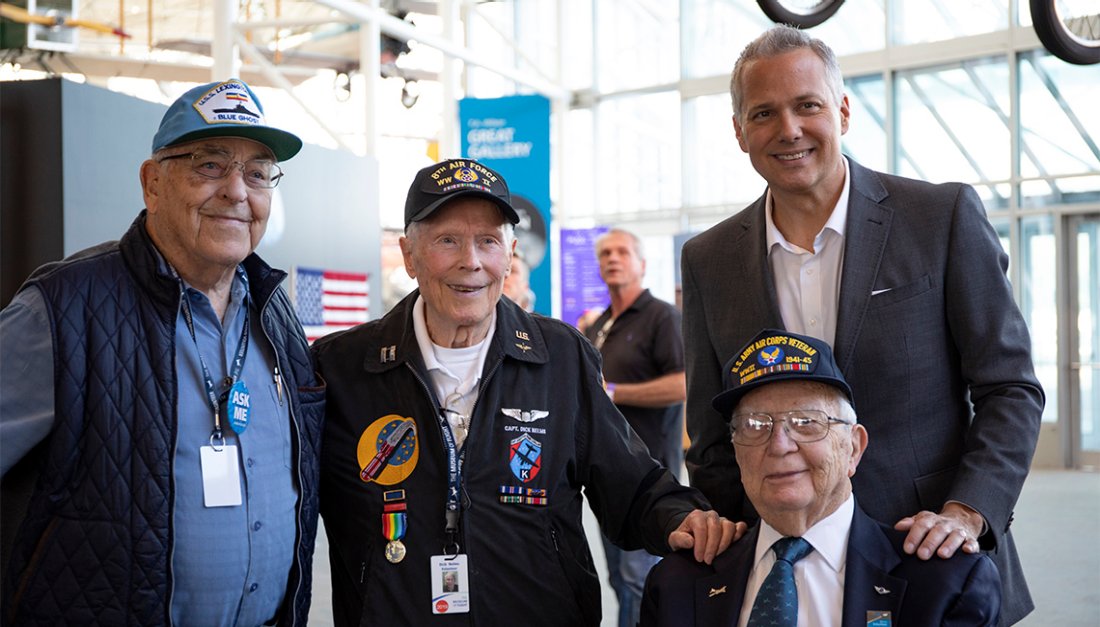 https://cdn.aarp.net/content/dam/aarp/travel/Domestic/2019/10/1140-wwii-vets-and-guest-esp.imgcache.rev.web.1100.627.jpg