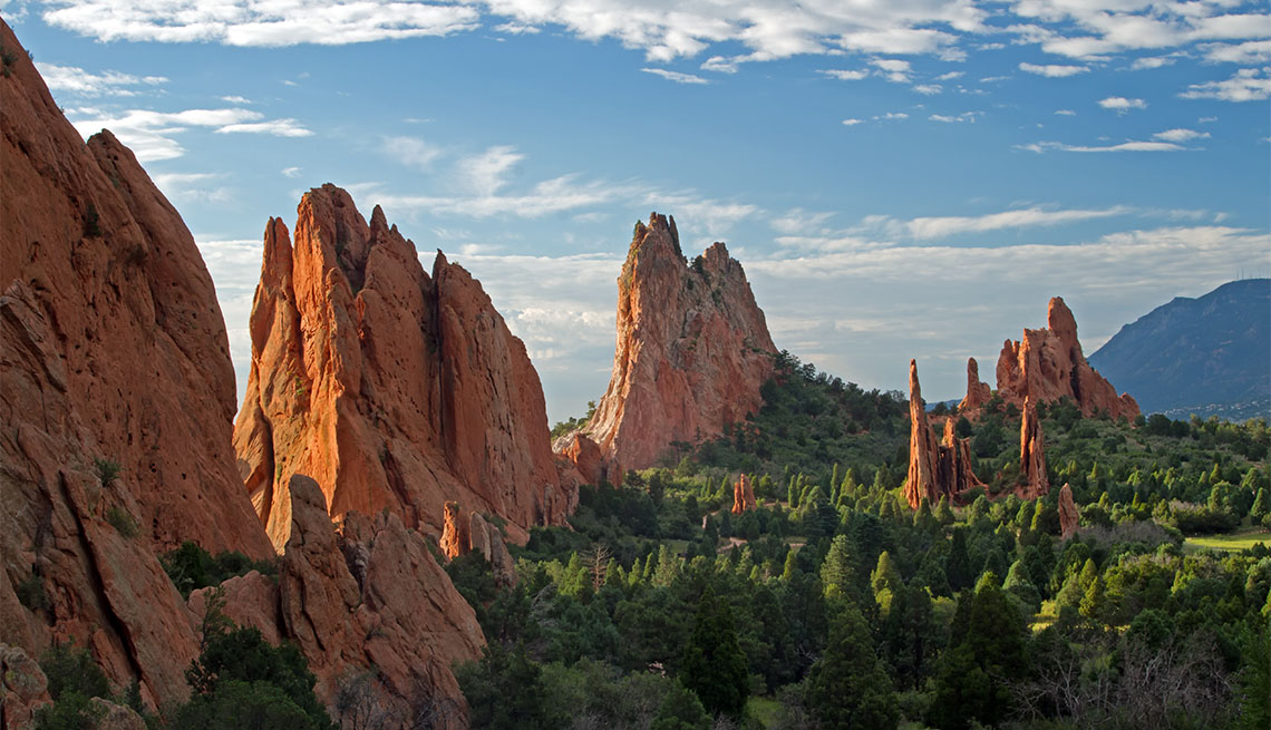 item 1 of Gallery image - Blue skies with clouds over lookout view of Garden of the Gods