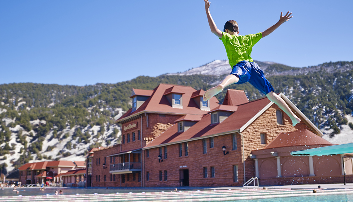 boy jumping into the pool at Glenwood Hot Springs