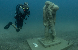 Driver viewing underwater Veteran's statue