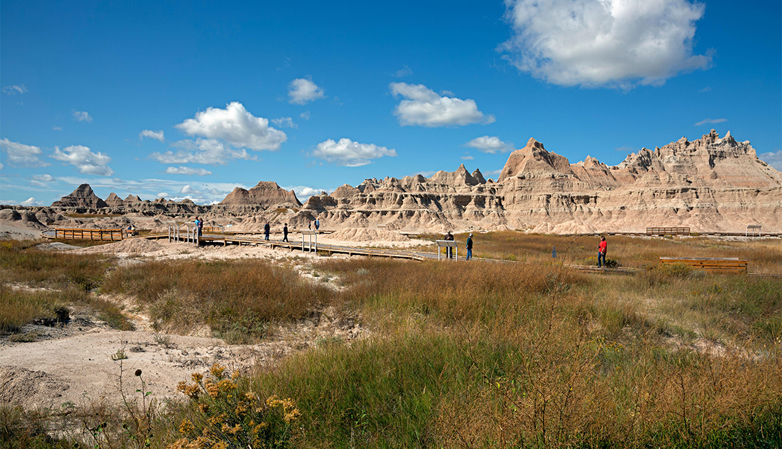Park visitors exploring the Fossil Exhibit Trail in Badlands National Park