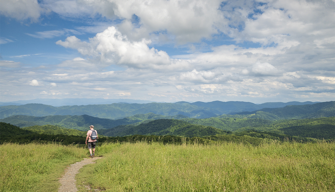 Hiking the Appalachian Trail with view of Smoky Mountains ,   on Max Patch Bald Mountain, North Carolina