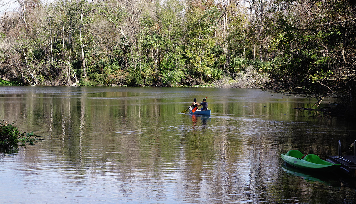 item 2 of Gallery image - Couple paddling a canoe at Wekiwa Springs State Park
