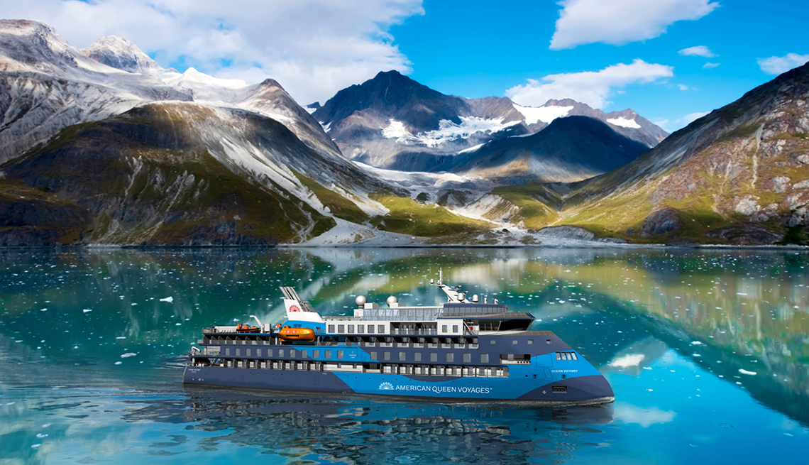 cruise ship in a stunning setting of mountains and arctic ice