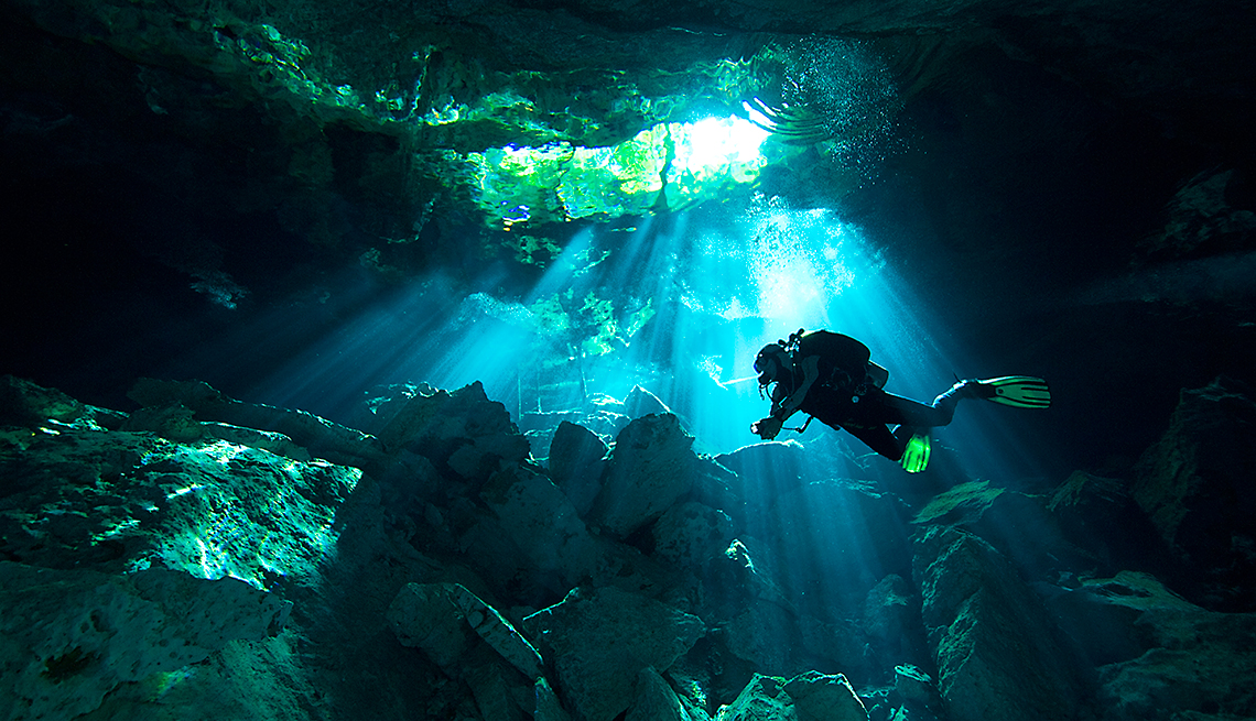 item 9 of Gallery image - a SCUBA diver in the Tulum cenotes