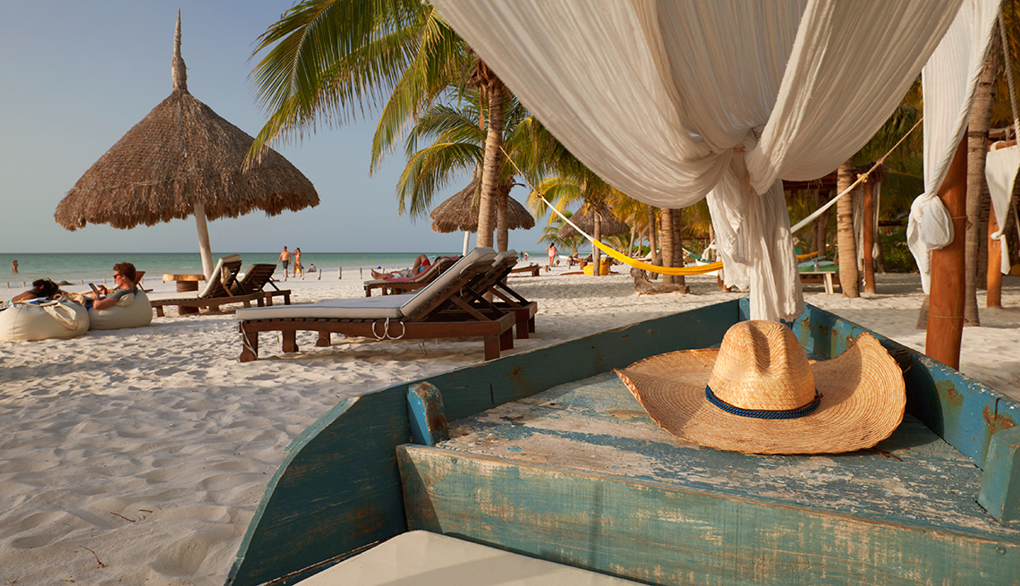 people relax on the beach at Holbox Island