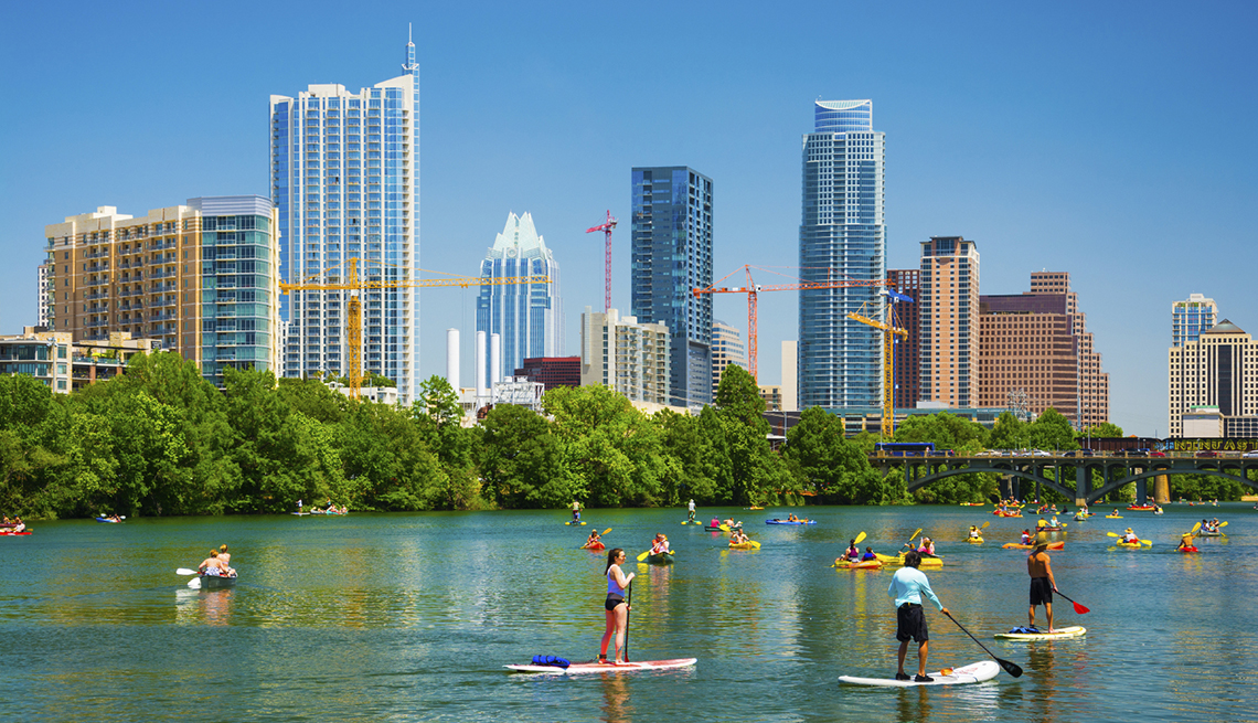 Austin skyline and people on paddleboards, cities for outdoor fun