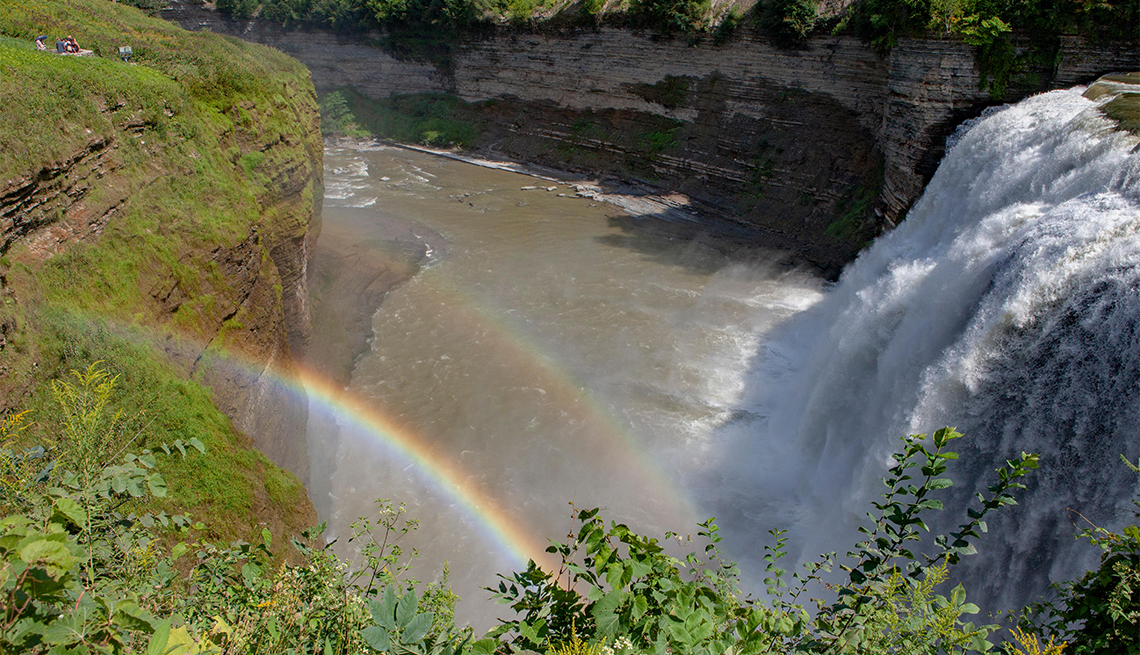item 13 of Gallery image - A double rainbow forms in the spray from the Middle Falls waterfall at Letchworth State Park