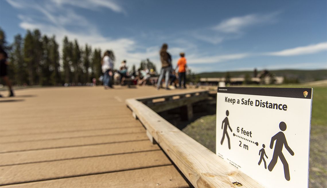 a social distancing sign at Yellowstone National Park 