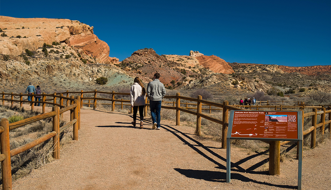 People walking on the Delicate Arch Viewpoint trail in Arches National Park