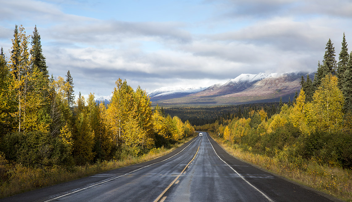 An RV heads down the George Parks Highway in Alaska on a fall day