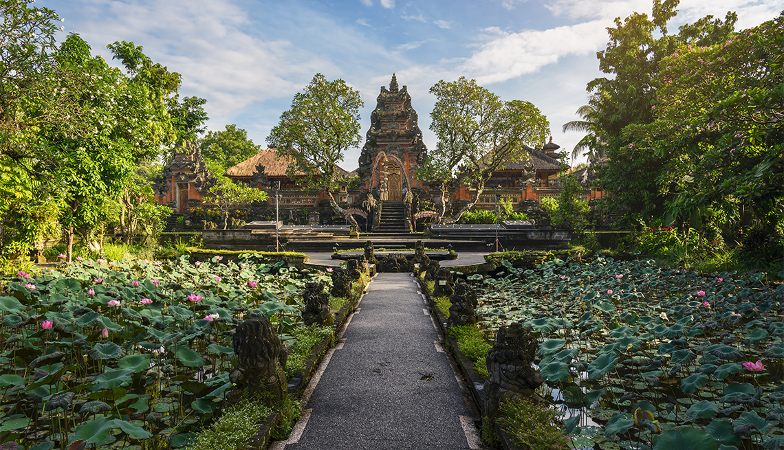 Lotus pond and Pura Saraswati temple in early morning, Ubud, Bali, Indonesia
