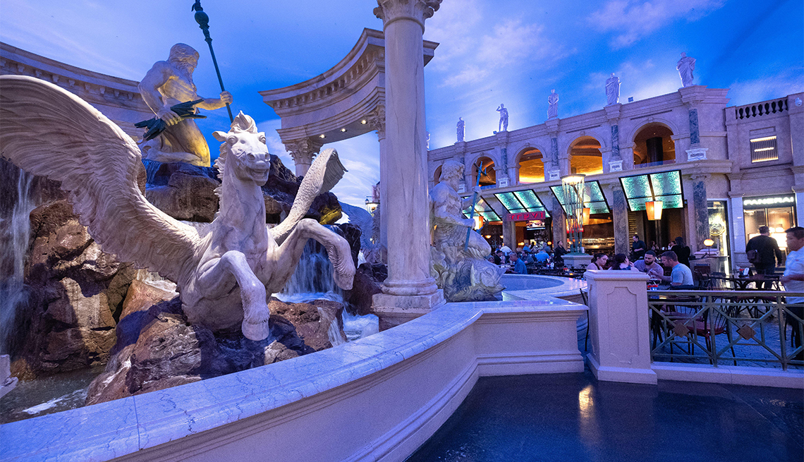 item 3 of Gallery image - Statues and ornate decor in the interior of The Forum Shops luxury shopping mall at Caesars Palace