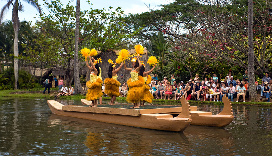 item 4 of Gallery image - Tahiti Dancers on boat with tourists observing at Polynesian Cultural Center 