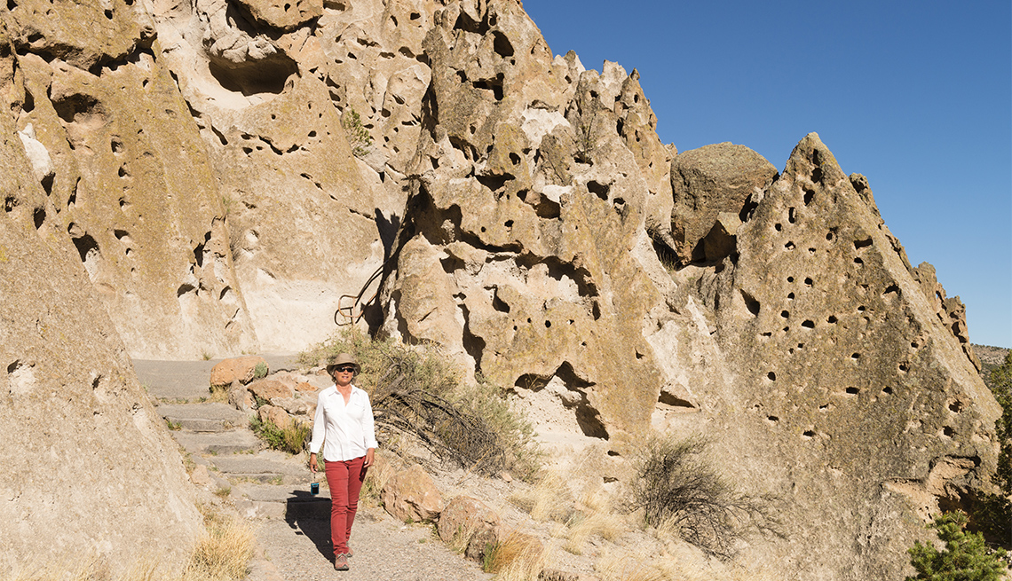 item 7 of Gallery image - Woman visiting Bandelier National Monument 