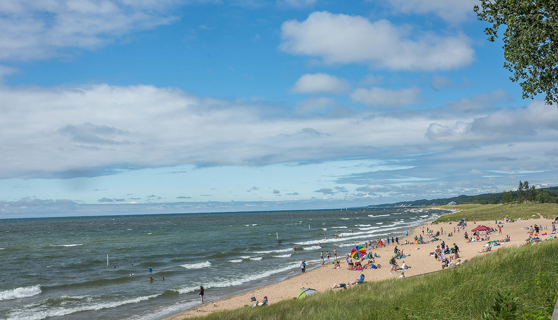 item 4 of Gallery image - a beach in Saugatuck, Michigan under blue skies