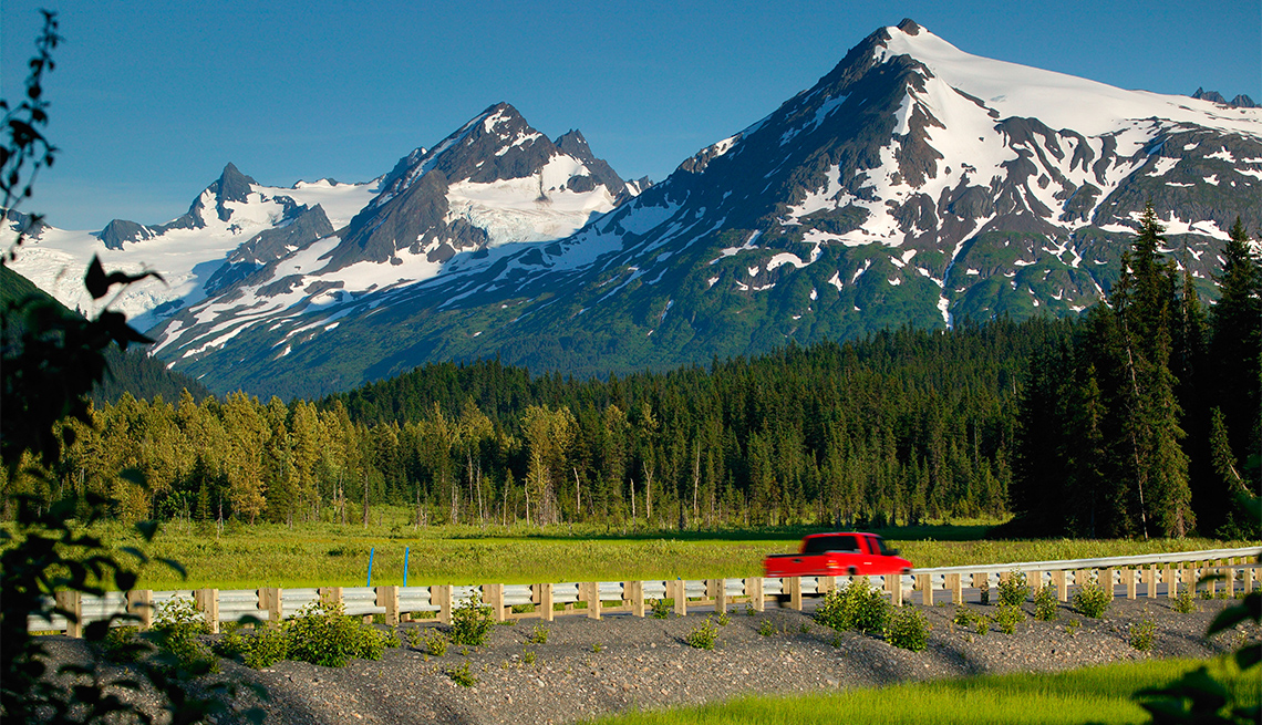 A car on the Seward Highway in the Chugach National Forest Kenai Peninsula Alaska