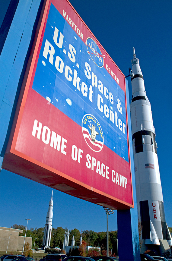 Saturn V mock-up stands next to the U.S. Space and Rocket Center sign located in Huntsville, Alabama