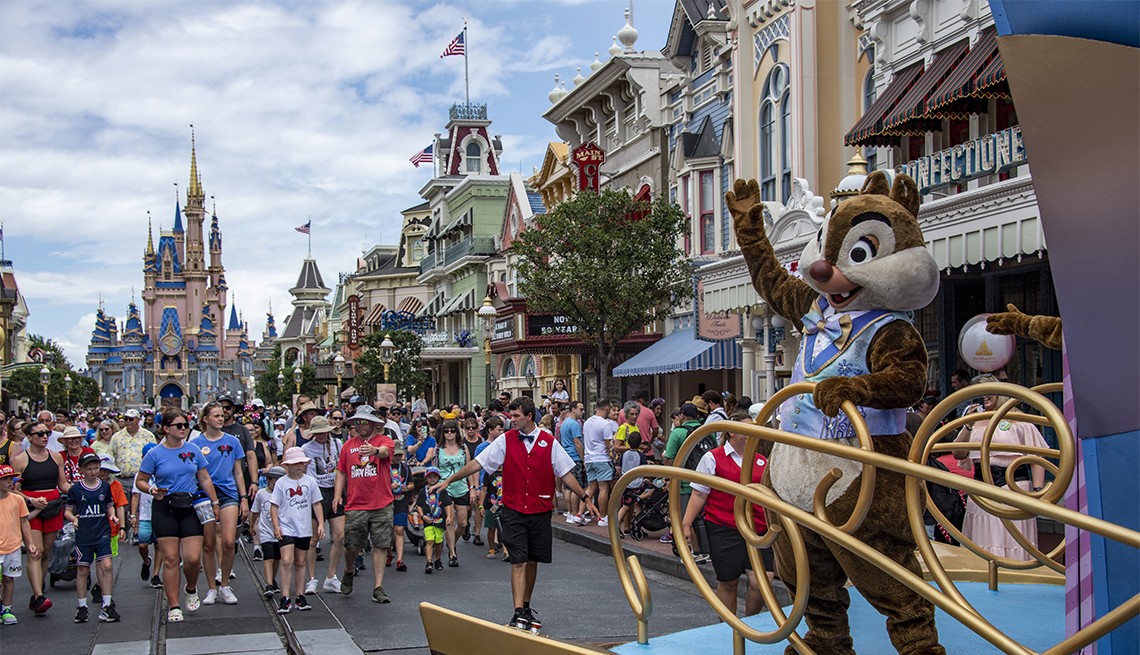 Chip and Dale waive to tourist at the end of a parade at the Magic Kingdom Park at Walt Disney World 