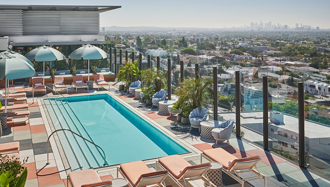 item 10 of Gallery image - rooftop pool at the pendry west hollywood hotel with a city view and downtown los angeles in the distance