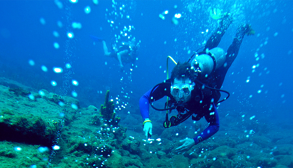 Scuba Diver Explores Geothermal Vents off Dominca, Caribbean Island Guide