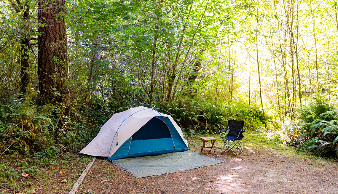 This is a wide angle photograph of a small dome camping tent setup at a Del Norte Campground in Redwoods National Park, California