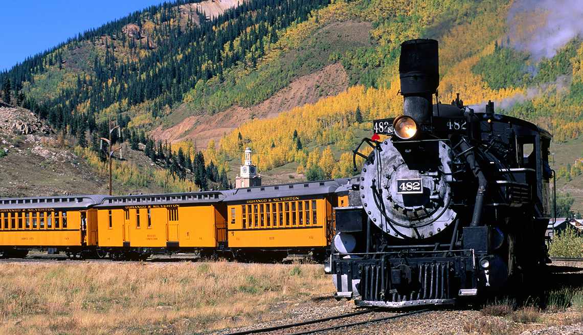 Steam train leaving town on Durango and Silverton Narrow Gauge Railroad
