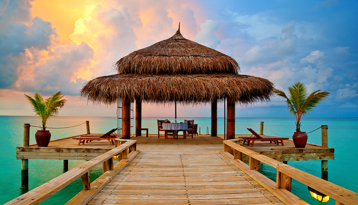 Tropical Ocean Sunset, DinneTr able Cabana. How to Break Your Vacation Debt Cycle
