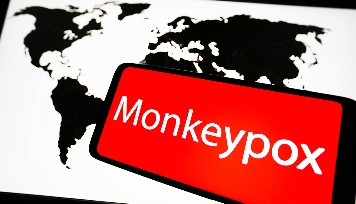 In this photo illustration, the word Monkeypox is seen with a world map