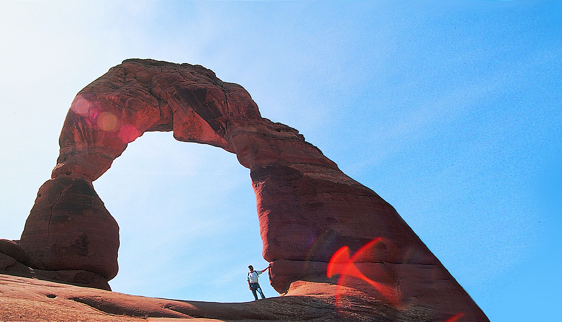 man standing at Arches National Park