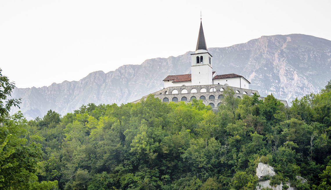 item 15 of Gallery image - A Church Steeple Peeps Above The Tree Line In Kobarid Slovenia, Under The Radar Destinations