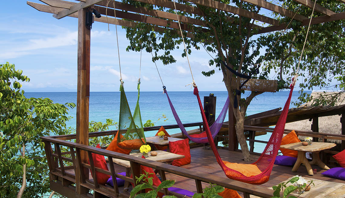 item 5 of Gallery image - View Of Patio With Hammocks Overlooking The Ocean In Koh Lipe Thailand, Under The Radar Destinations