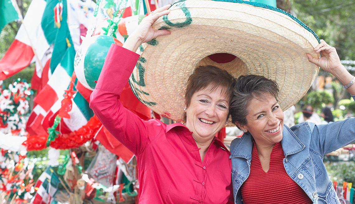 Mature Women Trying on Sombrero, Travel Safely in Mexico